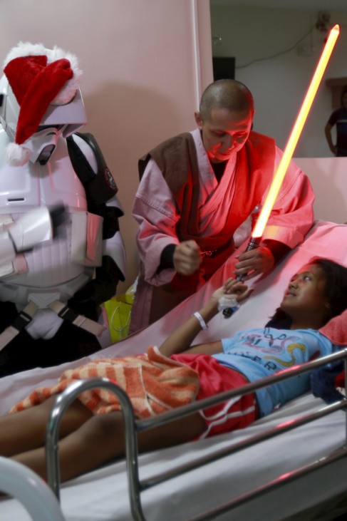 Cosplayers dressed as characters from the Star Wars movie series visit patients during a charity event organised by non-profit group 501st Legion, at East Avenue Medical Center in Quezon city, metro Manila