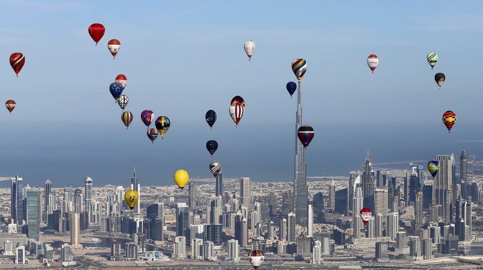 Hot air balloons fly over Dubai during the World Air Games 2015, held under the rules of the Federation Aeronautique Internationale as part of the 'Dubai International Balloon Fiesta' event