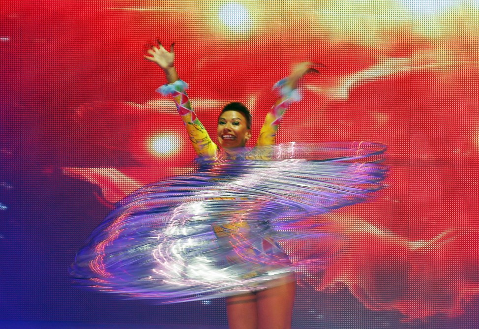 A dancer swings metal rings during an ice-skating show as part of the Ocean Park Christmas performances in Hong Kong