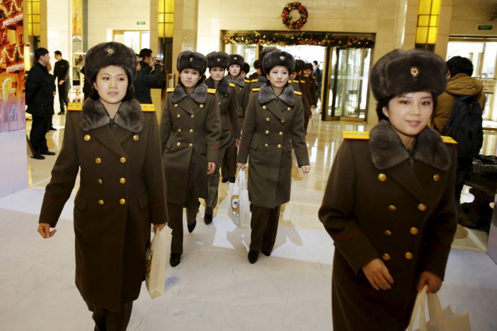 Members of the Moranbong Band from North Korea arrive at a hotel in central Beijing