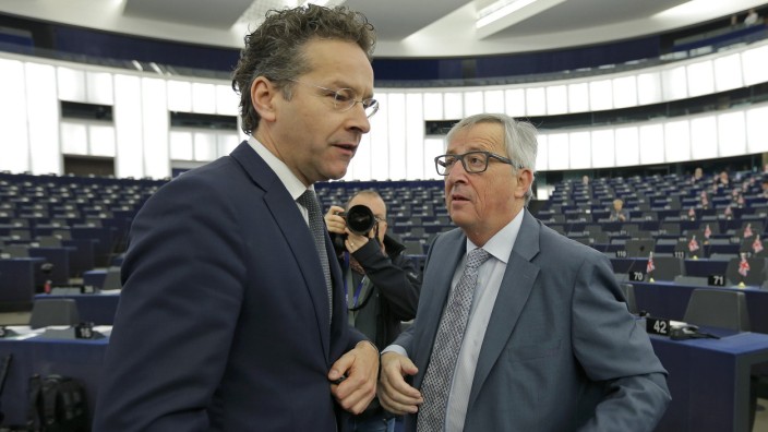 Commission President Juncker talks with Dutch Finance Minister and Eurogroup President Dijsselbloem at the European Parliament in Strasbourg