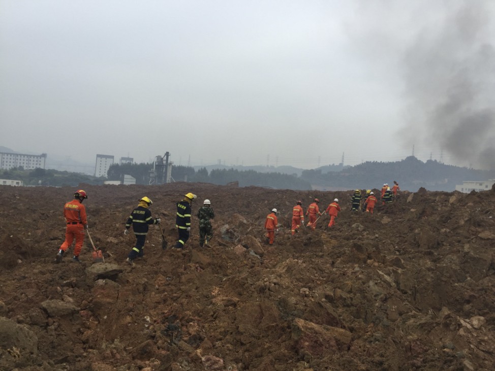 Rescuers search for survivors at the site of a landslide at an industrial park in Shenzhen