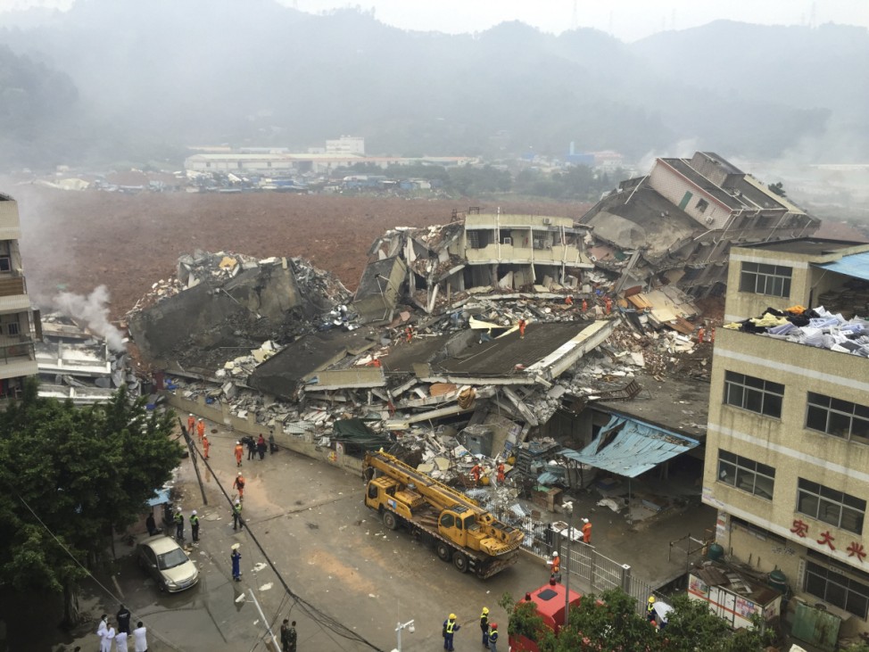 Damaged buildings are seen as rescuers search for survivors after a landslide hit an industrial park in Shenzhen