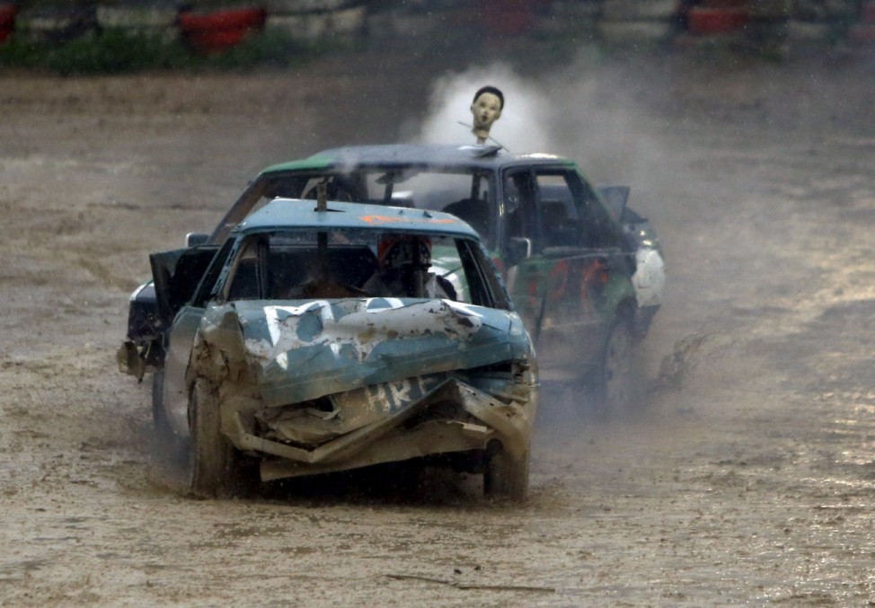 Drivers take part in a demolition derby organised by the Malta Motor Sports Association to raise funds for charity in Ta' Qali