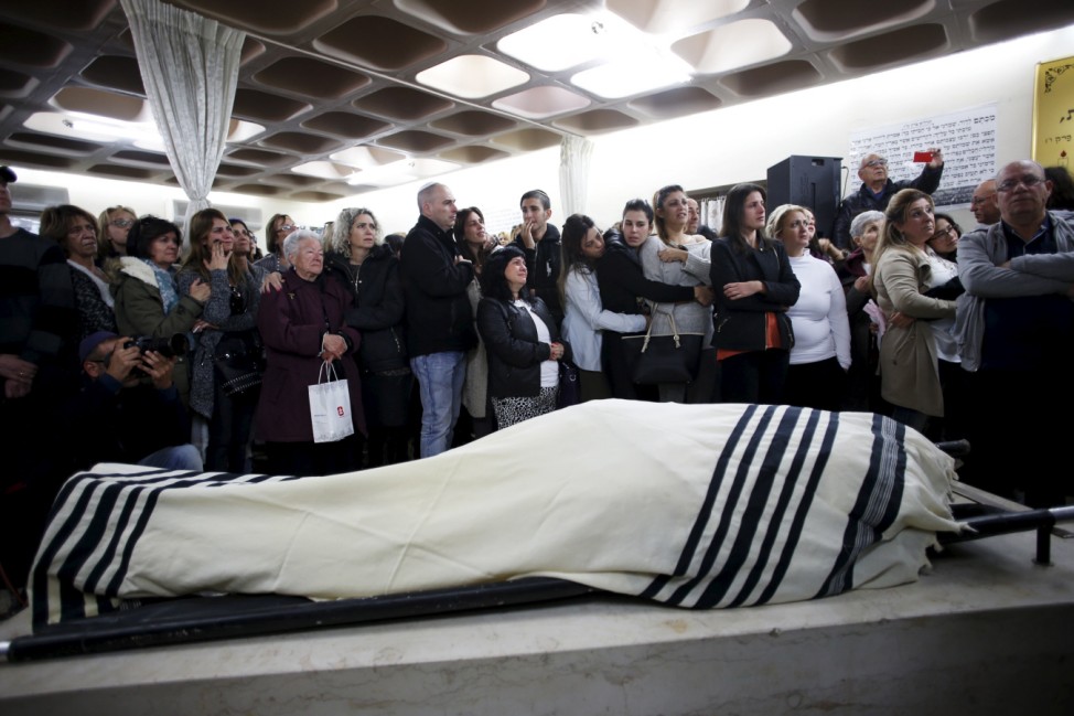 Friends and relatives mourn during the funeral of Ben Ari, who was killed by Israeli police gunfire aimed at two Palestinian stabbers on Wednesday, in Jerusalem