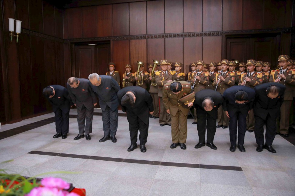 North Korean leader Kim Jong Un pays his respects to Kim Yang Gon in this undated photo released by North Korea's Korean Central News Agency (KCNA) in Pyongyang