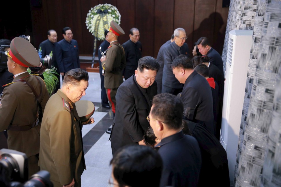 North Korean leader Kim Jong Un offers condolences to the relatives of Kim Yang Gon in this undated photo released by North Korea's Korean Central News Agency (KCNA) in Pyongyang