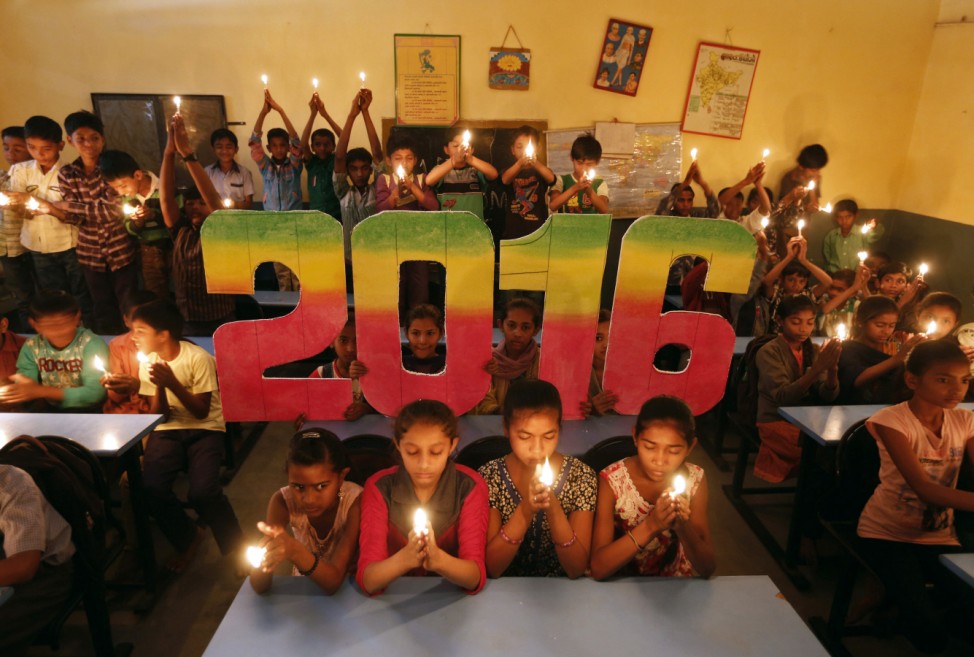 School students offer prayers for the world peace in the upcoming year of 2016 in Ahmedabad