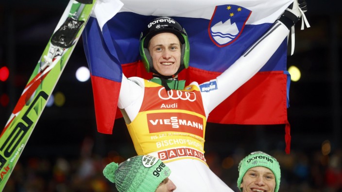 Prevc of Slovenia is carried on the shoulders of his Slovenian team mates after he won the overall ranking of the 64th four-hills Ski jumping tournament in Bischofshofen