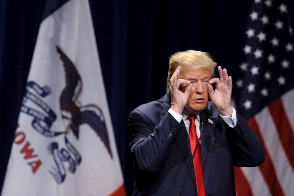 U.S. Republican presidential candidate Trump gestures during his speech at the Bridge View Center in Ottumwa