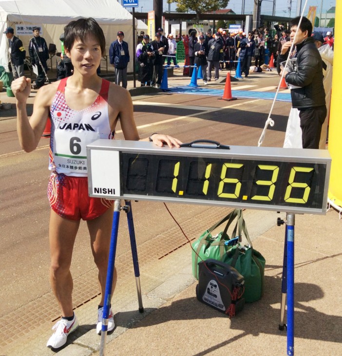 Japan s Suzuki breaks men s 20 km race walk world record Japan s Yusuke Suzuki poses by an electric