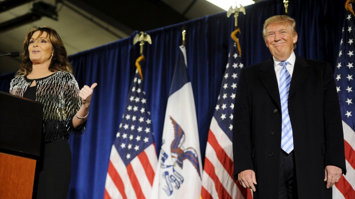 Palin points to U.S. Republican presidential candidate Trump as she speaks after endorsing him for President at a rally at Iowa State University in Ames, Iowa