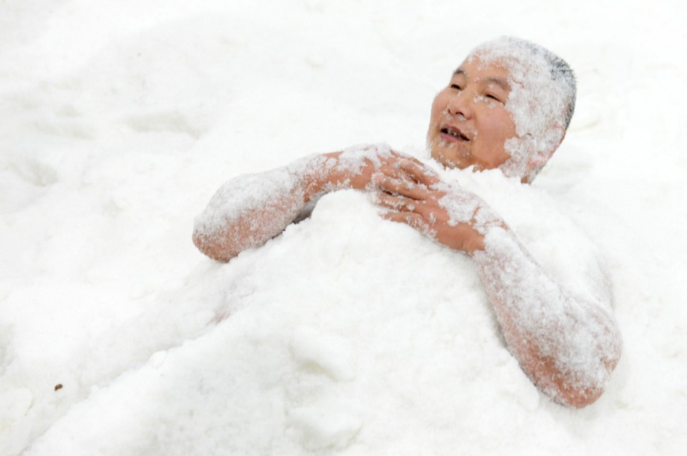 A man takes part in a cold enduring competition in Changsha