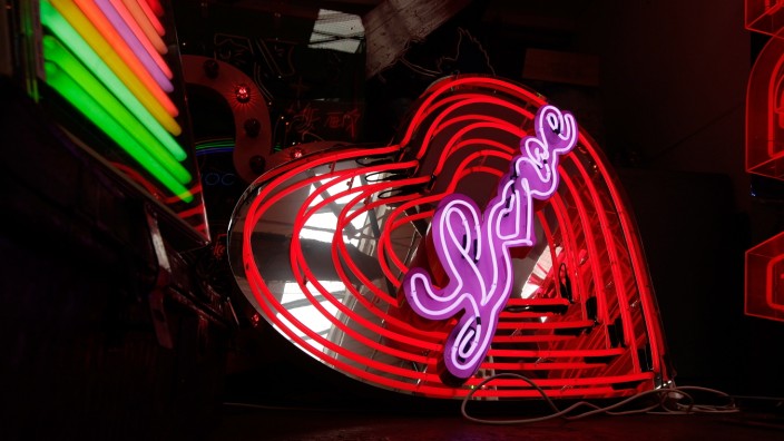 Workers Make And Renovate Neon Signs