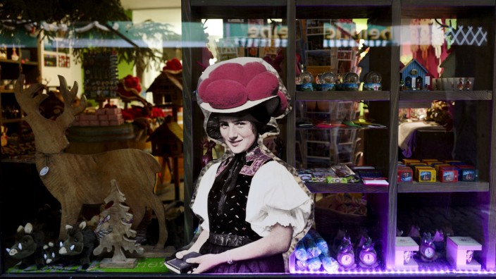 Modern interpretations of typical Black Forest souvenirs are seen in a shop window in the old town of Freiburg