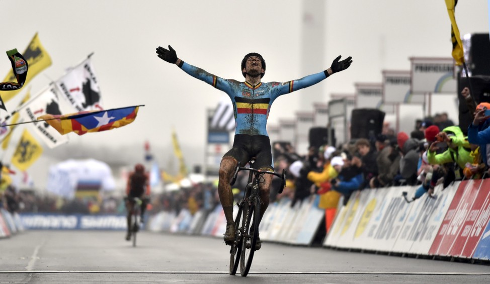Belgium's Wout Van Aert reacts as he crosses the finish line winning the cyclo-cross world championship in Heusden-Zolder