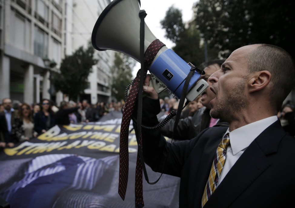 Greek lawyers stage a demonstration during a 24-hour general strike against planned pension reforms in Athens