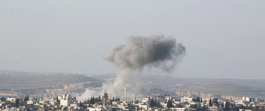 Smoke rises after airstrikes by pro-Syrian government forces in Anadan city