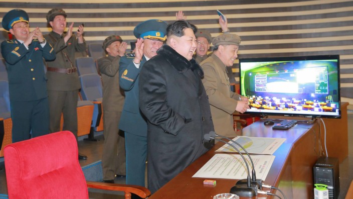 North Korean leader Kim Jong Un reacts as he watches a long range rocket launch in this undated photo released by North Korea's Korean Central News Agency (KCNA) in Pyongyang