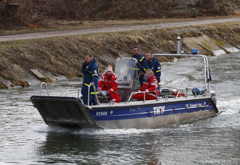 Members of emergency services boat on the river next to the two trains crash site near Bad Aibling