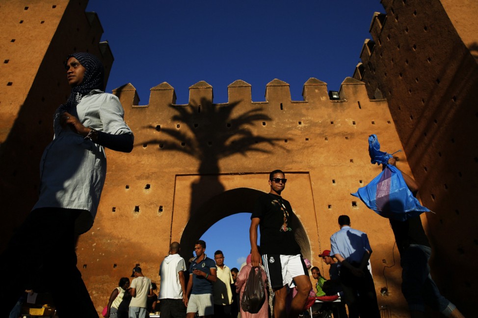 People walk through Bab el Had gates of Rabat's Medina