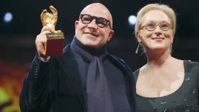 Director Gianfranco Rosi poses with Jury President Streep after receiving Golden Bear during awards ceremony at 66th Berlinale International Film Festival in Berlin