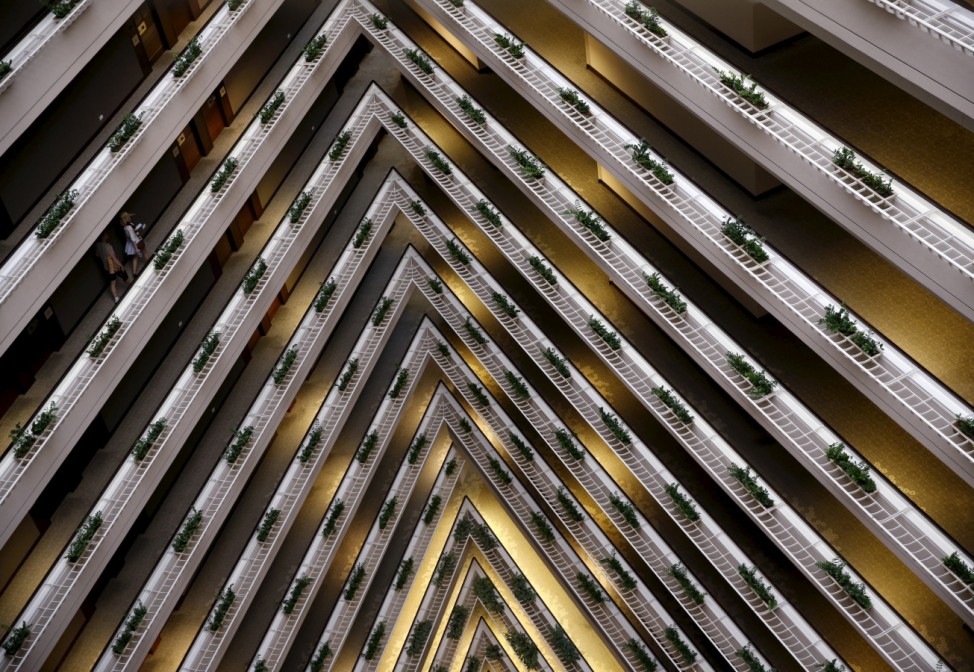 People walk in the corridor of the Pan Pacific Hotel in Singapore