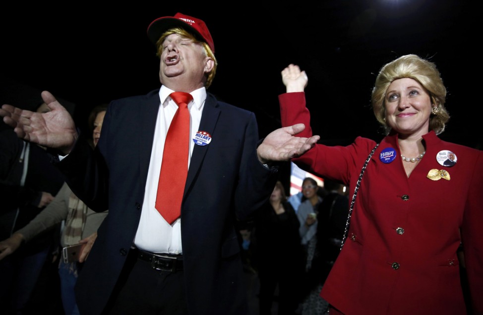 Supporters of Democratic U.S. presidential candidate Hillary Clinton, who came to her rally in costume as Republican presidential candidate Trump and as Mrs. Clinton attend her Super Tuesday night party in Miami
