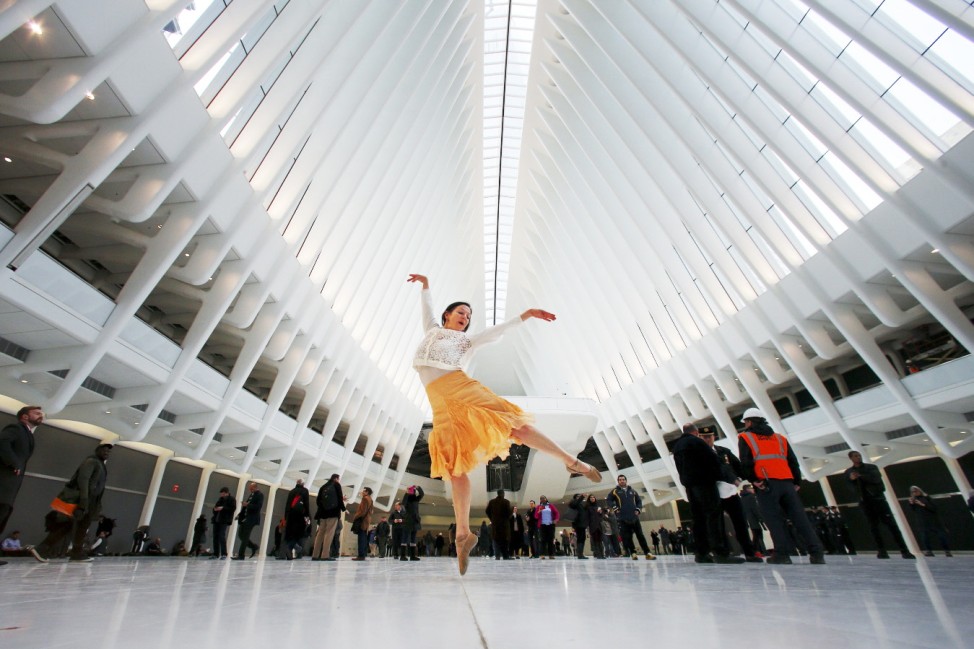 Dancer Laura Rae Bernasconi dances as she poses for photos at the World Trade Center Oculus transportation hub in the Manhattan borough of New York