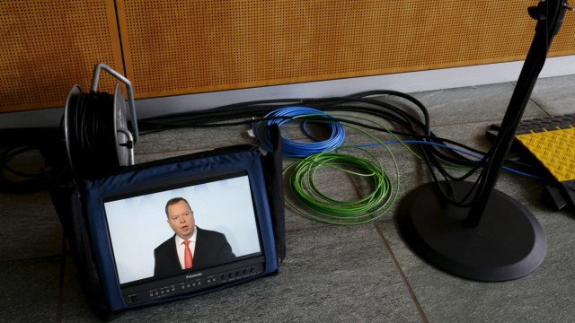 RWE CEO Terium is seen on a monitor during annual financial results news conference in Essen