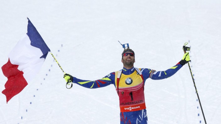 Martin Fourcade of France crosses the finish line to first place in the IBU World Championships Biathlon Men 12,5 km Pursuit in Holmenkollen Ski Arena in Oslo