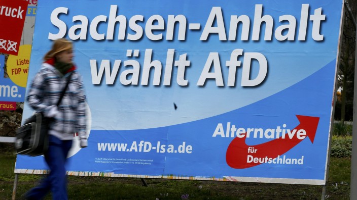 Pedestrian walks in front of an election poster for right-wing AFD in Magdeburg