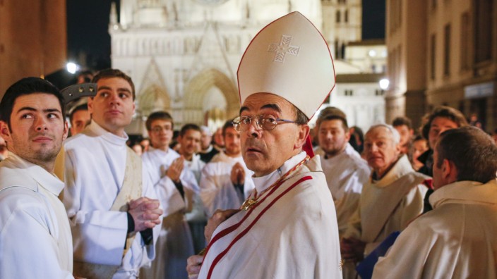 French Archbishop Philippe Barbarin leads the traditional procession to Mary, in Lyon