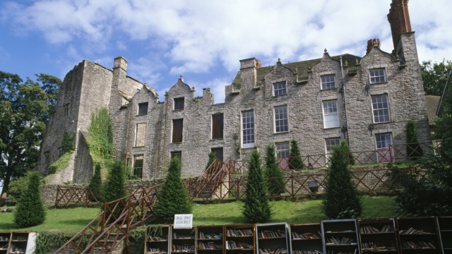 Wales Powys Hay on Wye Hay Castle and open air book stalls A Jacobean Mansion and book shop owne