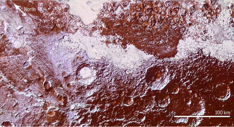 An enhanced color view showing Plutos surface diversity is seen in a mosaic of images from NASA's New Horizons spacecraft