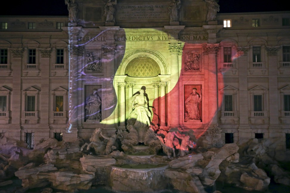 The black, yellow, and red colours of the Belgian flag are projected on the Trevi fountain in Rome, Italy, in tribute to the victims of today's Brussels bomb attacks