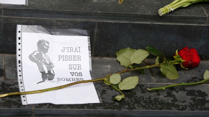 Flowers tributes are placed on steps of Belgian embassy in Berlin