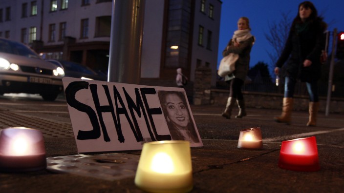 A candlelit vigil is held outside University Hospital Galway in Galway