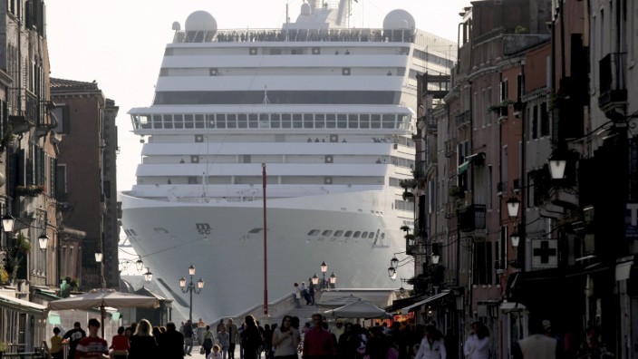 The cruise ship from Mediterranean Shipping Company Musica dwarfs Via Garibald as it arrives in Venice