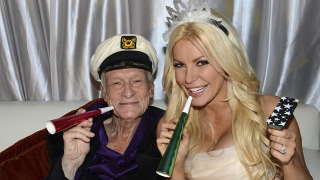 Octogenarian Playboy founder Hugh Hefner poses with his bride Crystal Harris as they ring in the new year at their wedding in Beverly Hills