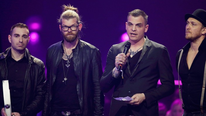 The band Frei Wild receives the award for the most successful 'National Alternative' artist during the 2016 Echo Music Award ceremony in Berlin