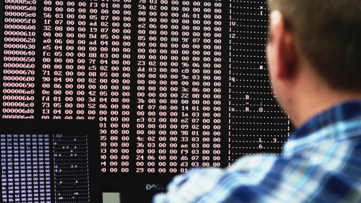 An analyst looks at code in the malware lab of a cyber security defense lab at the Idaho National Laboratory