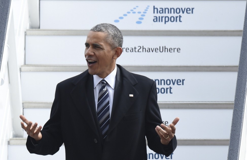 U.S. President Obama reacts as he leaves Air Force One after landing in Hanover airport