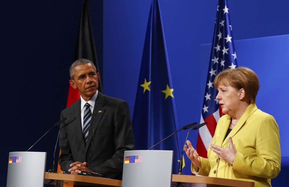 German Chancellor Merkel and U.S. President Obama speak to media during a news conference after their talks at Schloss Herrenhausen in Hanover