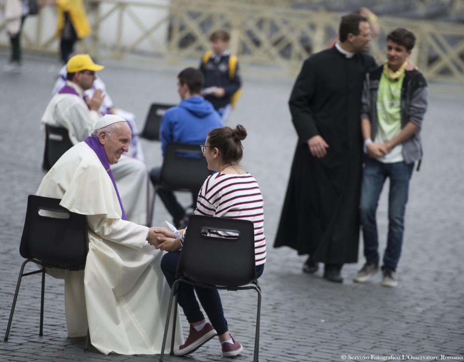 Pope Francis hears confessions