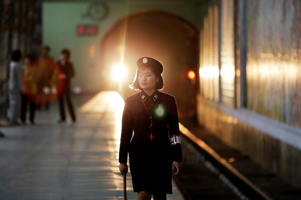 A subway worker walks away after a train departed the station in central Pyongyang