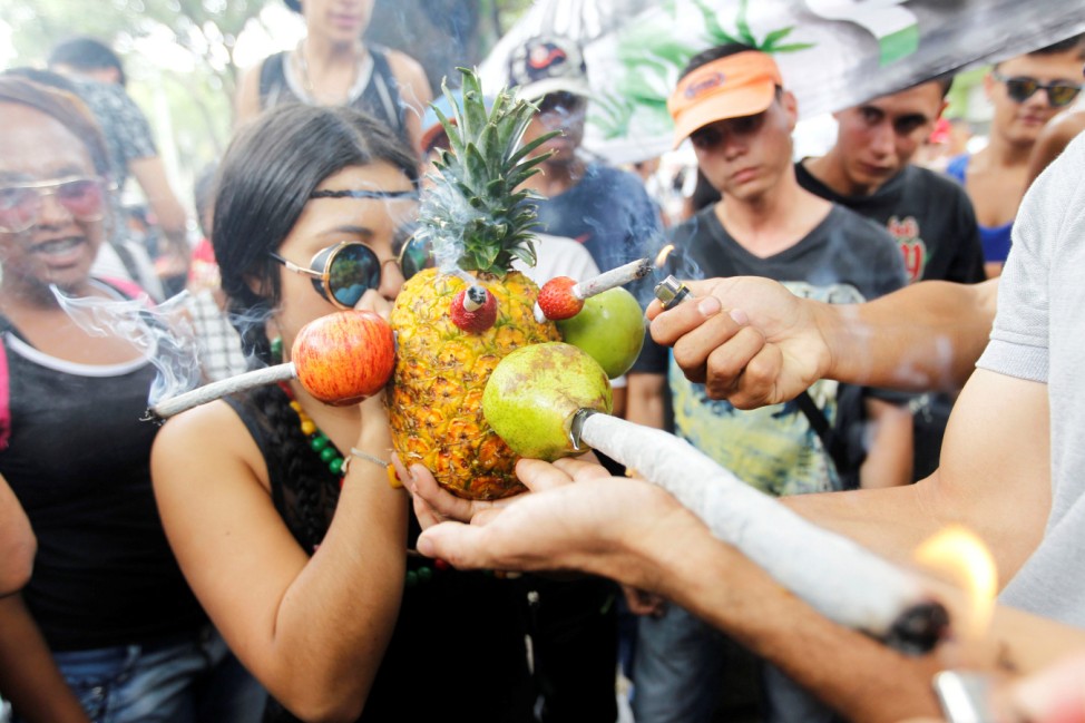 A man smokes marijuana during a global March for marijuana in Medellin, Colombia