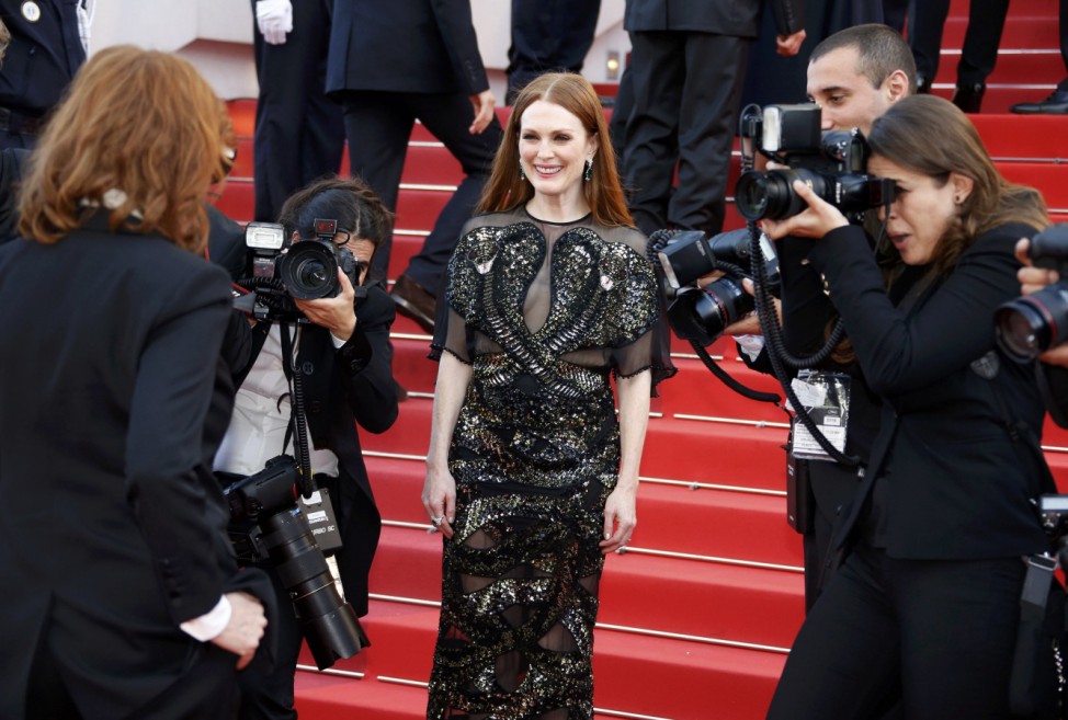 Actress Julianne Moore poses on the red carpet as she arrives for the opening ceremony and the screening of the film 'Cafe Society' out of competition during the 69th Cannes Film Festival in Cannes