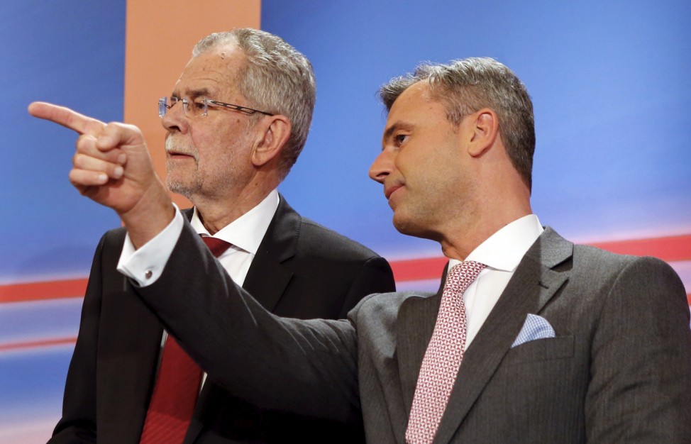 Presidential candidates Alexander van der Bellen and Norbert Hofer react during a TV debate in Vienna