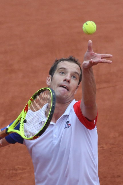 Richard Gasquet of France serves during his French Open men s fourth round match against Kei Nishiko